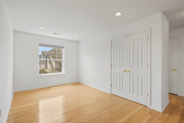 402 Waterview Dr, Poughkeepsie, NY 12601 - unfurnished bedroom with wood-type flooring, recessed lighting, and a closet