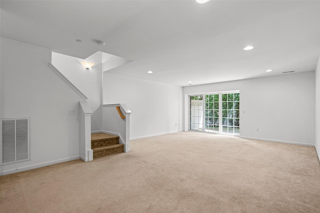 402 Waterview Dr, Poughkeepsie, NY 12601 - unfurnished living room featuring carpet flooring, stairs, and recessed lighting