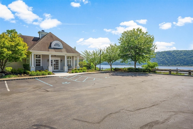 402 Waterview Dr, Poughkeepsie, NY 12601 - view of building exterior featuring uncovered parking and a water view