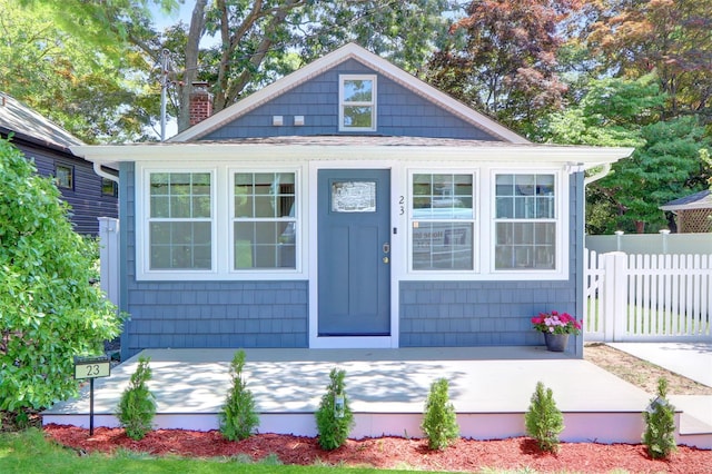 23 Eastport Dr, Sound Beach, NY 11789 - bungalow featuring a chimney