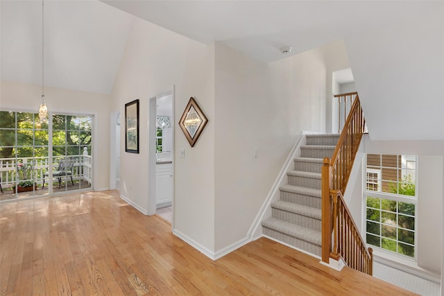 15 Deertree Ln, Briarcliff Manor, NY 10510 - stairway featuring hardwood / wood-style flooring and high vaulted ceiling