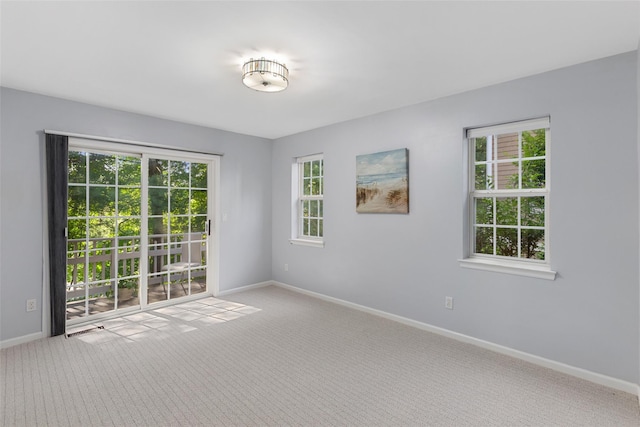 15 Deertree Ln, Briarcliff Manor, NY 10510 - spare room featuring light carpet and plenty of natural light