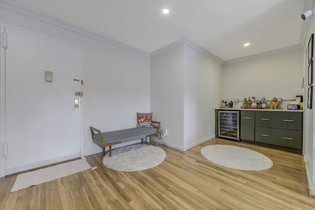 5 Birchwood Ct Unit 4N, Mineola, NY 11501 - indoor dry bar featuring beverage cooler, ornamental molding, light wood finished floors, and recessed lighting