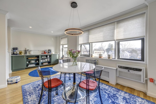 5 Birchwood Ct Unit 4N, Mineola, NY 11501 - dining room featuring wood finished floors, an AC wall unit, crown molding, recessed lighting, and radiator
