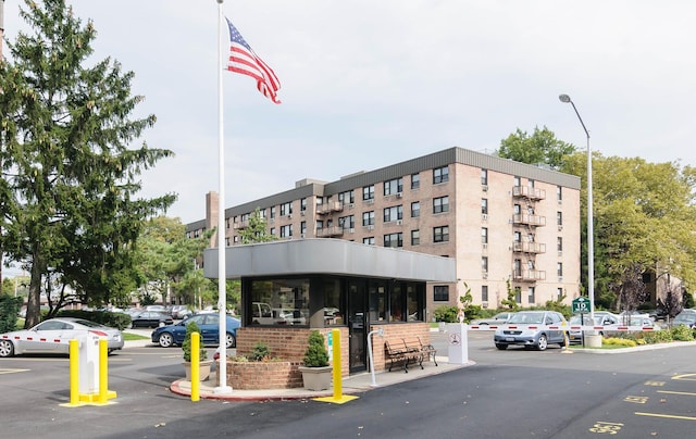 5 Birchwood Ct Unit 4N, Mineola, NY 11501 - view of building exterior featuring uncovered parking