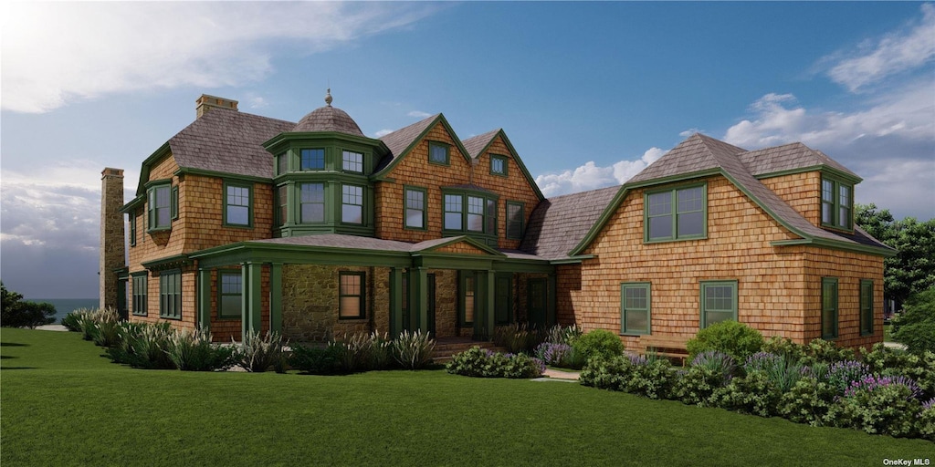 63 Lake Rd, Manhasset, NY 11030 - rear view of house with covered porch and a yard