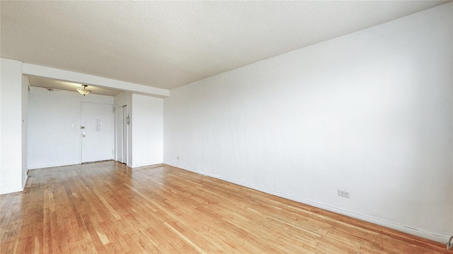 8420 153rd Ave Unit 6H, Howard Beach, NY 11414 - spare room featuring light wood finished floors