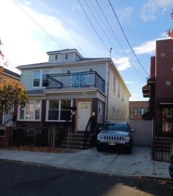 334 E 55th St, Brooklyn, NY 11203 - american foursquare style home featuring a balcony