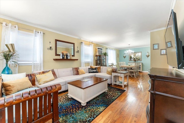 2 Croydon Dr, North Bellmore, NY 11710 - living area with a chandelier, crown molding, and wood finished floors
