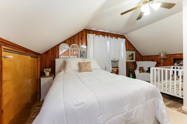 2 Croydon Dr, North Bellmore, NY 11710 - bedroom featuring wood finished floors, vaulted ceiling, wooden walls, and ceiling fan