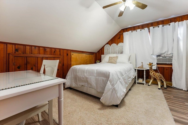 2 Croydon Dr, North Bellmore, NY 11710 - bedroom featuring vaulted ceiling, light wood finished floors, cooling unit, wooden walls, and ceiling fan