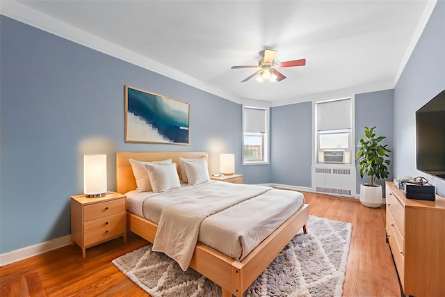 9437 Shore Rd Unit E6, Brooklyn, NY 11209 - bedroom with radiator, cooling unit, ceiling fan, light wood finished floors, and ornamental molding