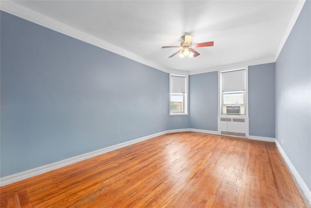 9437 Shore Rd Unit E6, Brooklyn, NY 11209 - unfurnished room with radiator heating unit, light wood-style flooring, a ceiling fan, and cooling unit