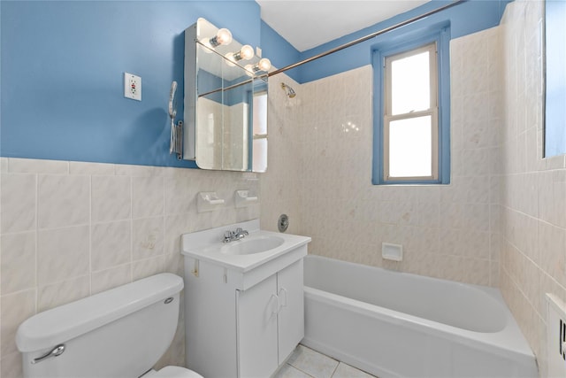 9437 Shore Rd Unit E6, Brooklyn, NY 11209 - bathroom with tile walls, vanity, washtub / shower combination, and tile patterned flooring