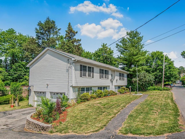 237 Brady Ave, Hawthorne, NY 10532 - view of side of property featuring asphalt driveway, an attached garage, and a lawn