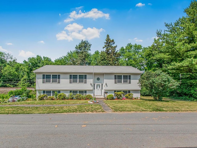 237 Brady Ave, Hawthorne, NY 10532 - split foyer home with a front yard and view of scattered trees