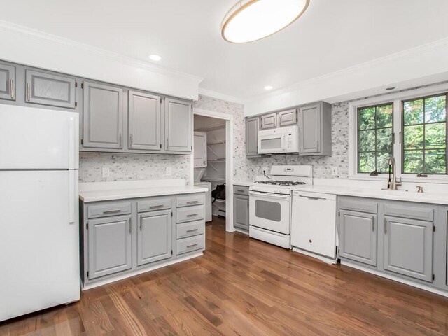237 Brady Ave, Hawthorne, NY 10532 - kitchen with gray cabinetry, white appliances, crown molding, light countertops, and dark wood-style floors