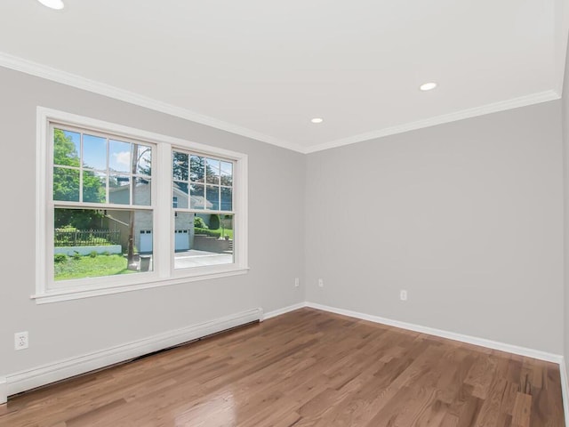 237 Brady Ave, Hawthorne, NY 10532 - empty room with baseboard heating, healthy amount of natural light, wood finished floors, ornamental molding, and recessed lighting