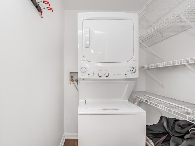 237 Brady Ave, Hawthorne, NY 10532 - laundry room featuring stacked washing machine and dryer and baseboards