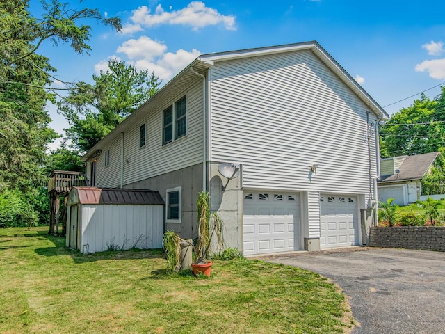 237 Brady Ave, Hawthorne, NY 10532 - view of property exterior with an attached garage, driveway, a lawn, and a storage shed
