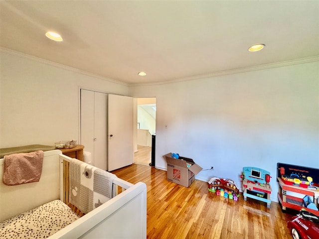 48 Marlene Dr, Syosset, NY 11791 - bedroom with wood finished floors, recessed lighting, ornamental molding, and a closet
