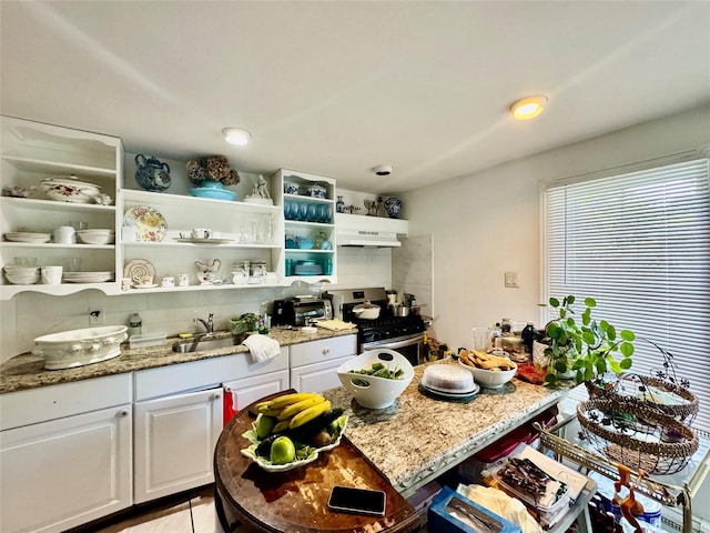 48 Marlene Dr, Syosset, NY 11791 - kitchen with gas stove, open shelves, white cabinets, and light stone countertops