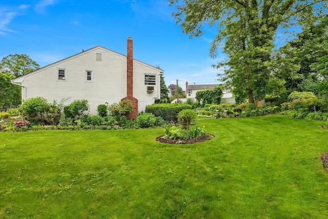 48 Marlene Dr, Syosset, NY 11791 - view of property exterior featuring a chimney and a lawn