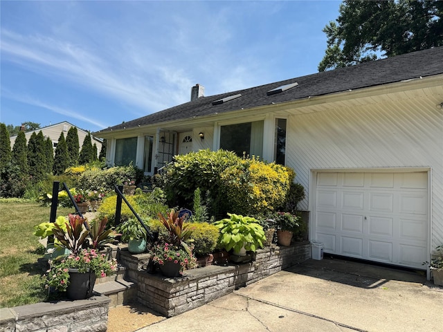 48 Marlene Dr, Syosset, NY 11791 - view of front of property featuring a chimney, driveway, and an attached garage