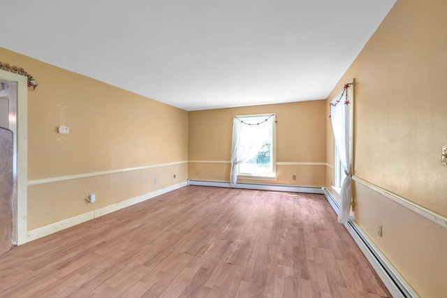 2 Gerri Ct, Wallkill, NY 12589 - spare room featuring a baseboard radiator and wood finished floors