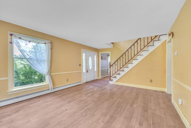 2 Gerri Ct, Wallkill, NY 12589 - entryway with a baseboard radiator, stairway, wood finished floors, and plenty of natural light
