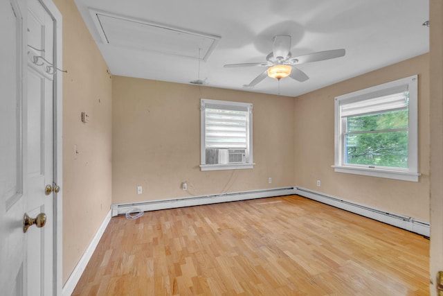 2 Gerri Ct, Wallkill, NY 12589 - spare room featuring attic access, baseboard heating, wood finished floors, and ceiling fan