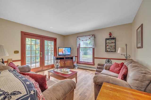2 Gerri Ct, Wallkill, NY 12589 - living room with french doors, a baseboard heating unit, wood finished floors, and healthy amount of natural light