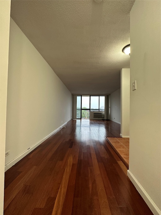 15038 Union Tpke Unit 3D, Kew Garden Hills, NY 11367 - empty room with a textured ceiling and wood finished floors