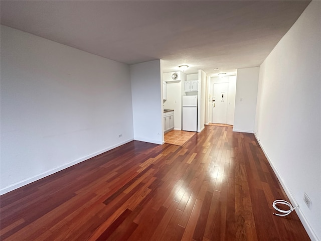 15038 Union Tpke Unit 3D, Kew Garden Hills, NY 11367 - unfurnished room featuring dark wood-type flooring and baseboards