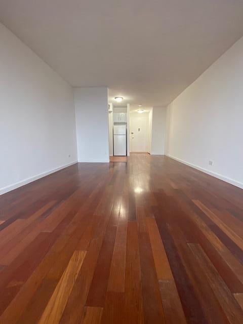 15038 Union Tpke Unit 3D, Kew Garden Hills, NY 11367 - empty room featuring wood-type flooring and baseboards