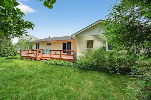 11 Seth Dr, New Hampton, NY 10958 - back of property with a yard and a deck