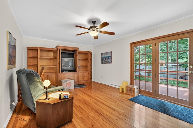 11 Seth Dr, New Hampton, NY 10958 - living room with baseboard heating, ceiling fan, light wood-type flooring, and ornamental molding