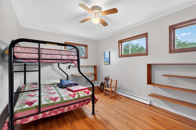 11 Seth Dr, New Hampton, NY 10958 - bedroom with a baseboard radiator, wood finished floors, multiple windows, ornamental molding, and ceiling fan