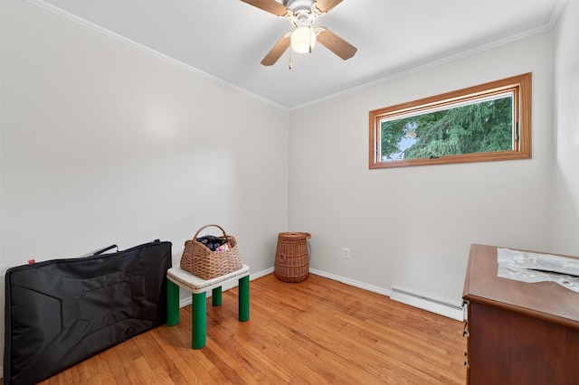11 Seth Dr, New Hampton, NY 10958 - living area featuring a baseboard radiator, wood finished floors, a ceiling fan, and ornamental molding