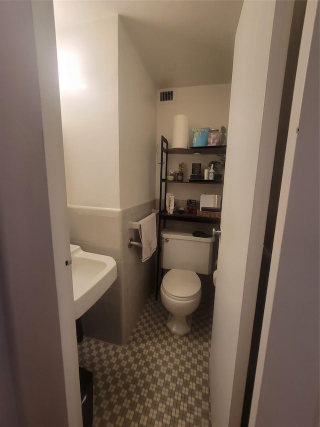 9 Fordham Hill Oval Unit 5C, Bronx, NY 10468 - half bathroom featuring toilet and tile patterned floors