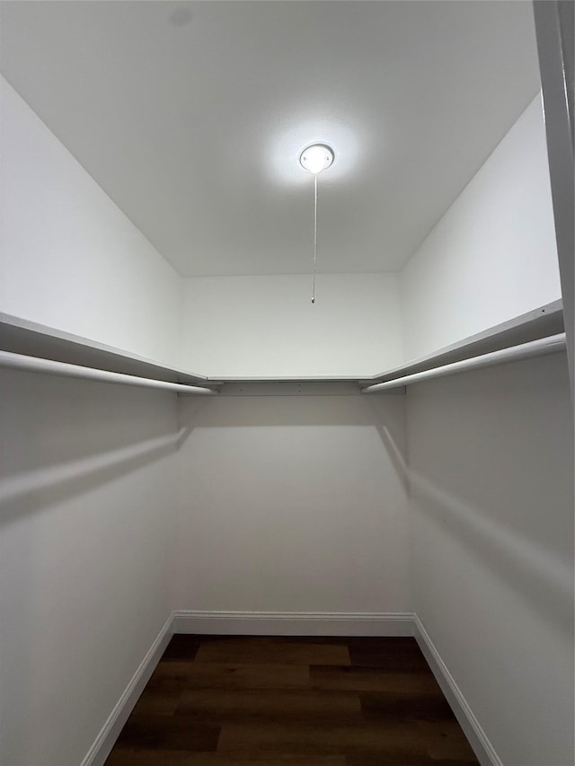 77 Adams Rd Unit 1D, Central Islip, NY 11722 - walk in closet with dark wood-style floors