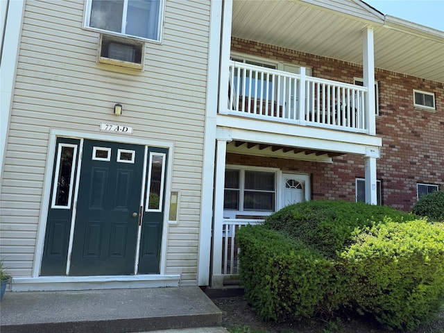 77 Adams Rd Unit 1D, Central Islip, NY 11722 - property entrance with brick siding and a balcony