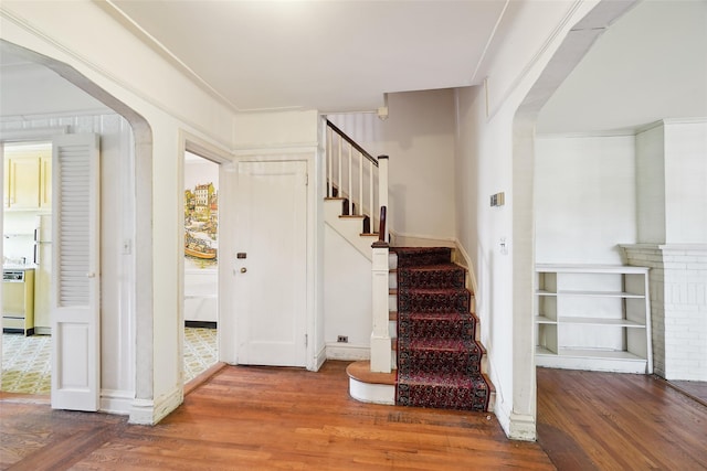 9 Bacon Ct, Bronxville, NY 10708 - entrance foyer with arched walkways, wood finished floors, and stairway