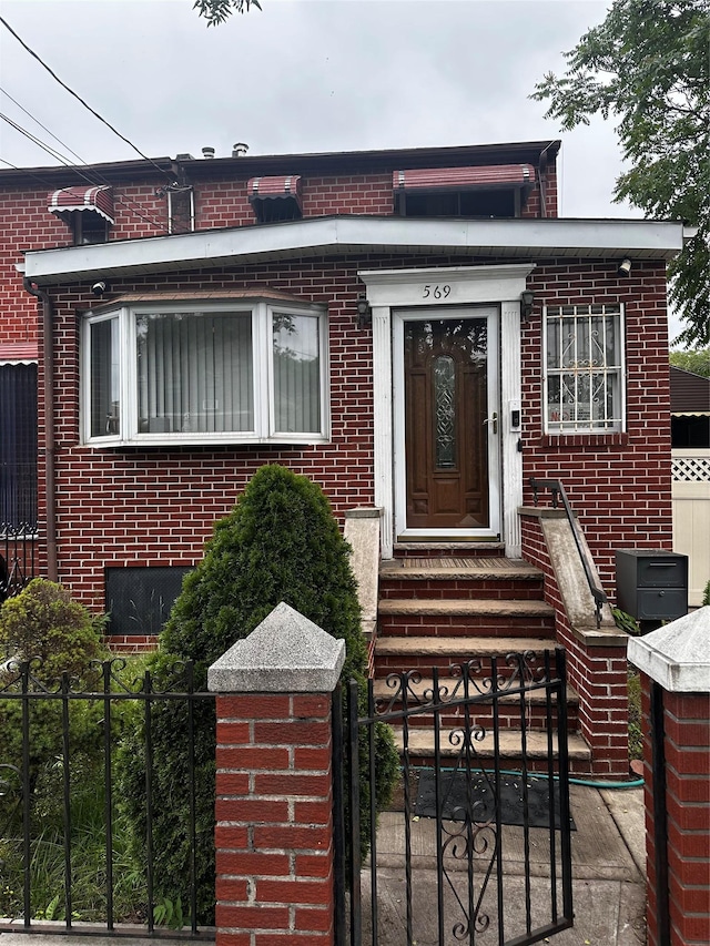 569 Warwick St, Brooklyn, NY 11207 - entrance to property featuring brick siding and a gate