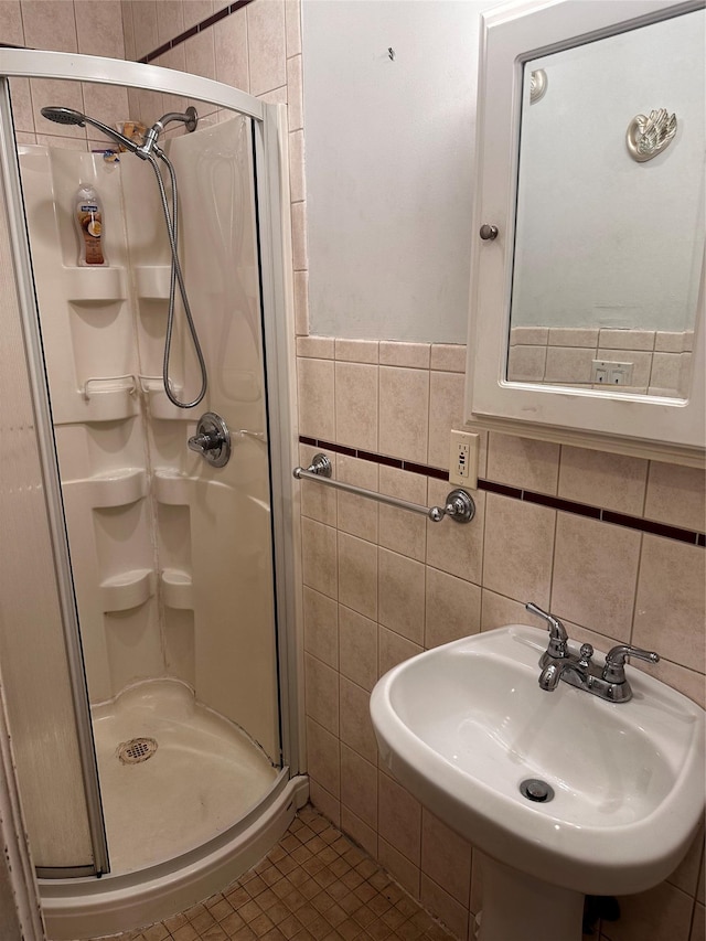 569 Warwick St, Brooklyn, NY 11207 - full bathroom with tile walls, a stall shower, and tile patterned flooring