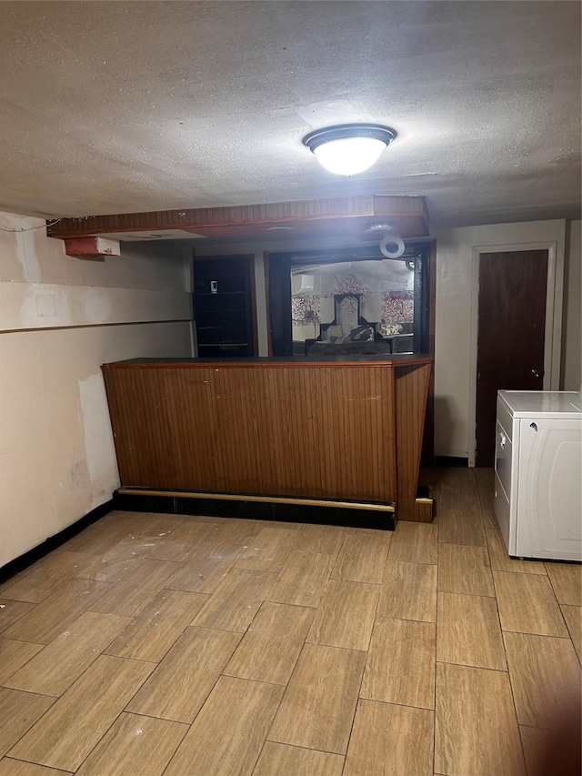 569 Warwick St, Brooklyn, NY 11207 - welcome area featuring washer / clothes dryer and a textured ceiling