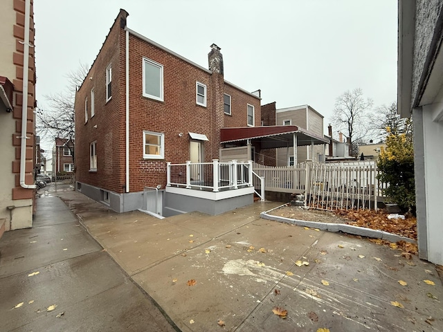 4223 Boyd Ave, Bronx, NY 10466 - view of home's exterior with brick siding and a chimney