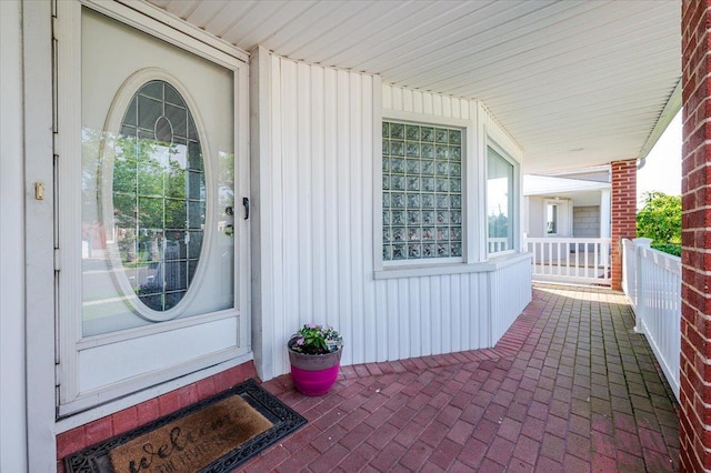 3478 Woodward St, Oceanside, NY 11572 - entrance to property featuring covered porch and board and batten siding