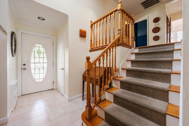 3478 Woodward St, Oceanside, NY 11572 - entryway featuring stairway, crown molding, and tile patterned floors