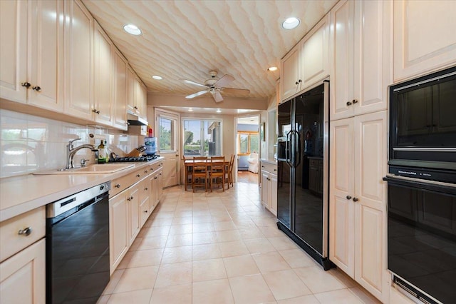 3478 Woodward St, Oceanside, NY 11572 - kitchen with black appliances, under cabinet range hood, light countertops, recessed lighting, and ceiling fan